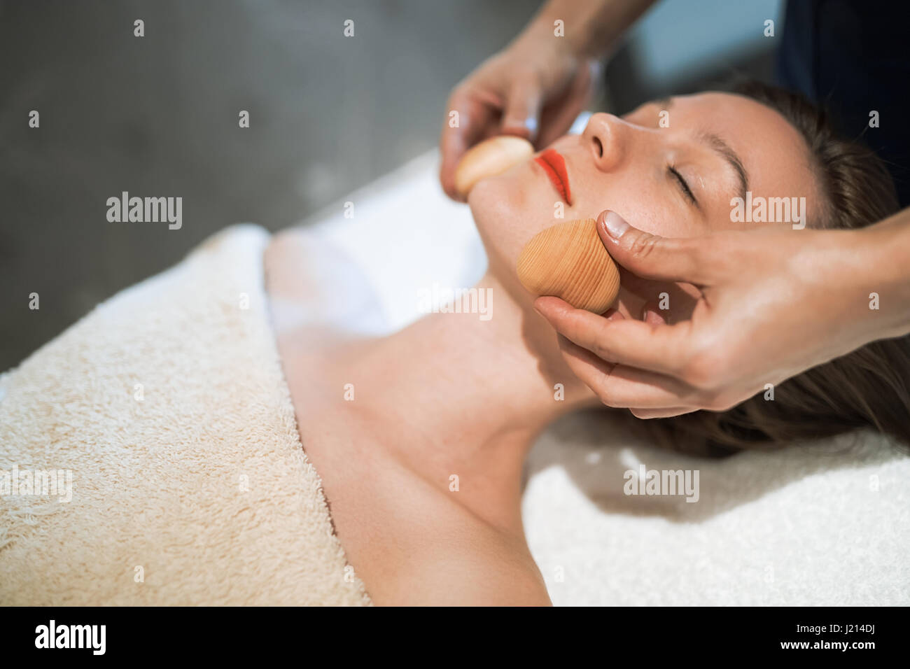 Masseur treating patient with therapeutic massage treatment Stock Photo