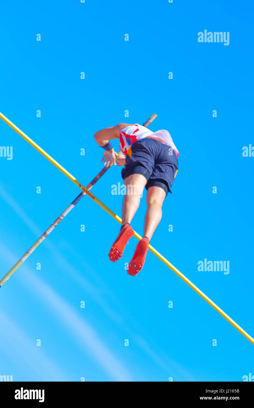 outdooor young adult male pole vaulting competition held 22nd april