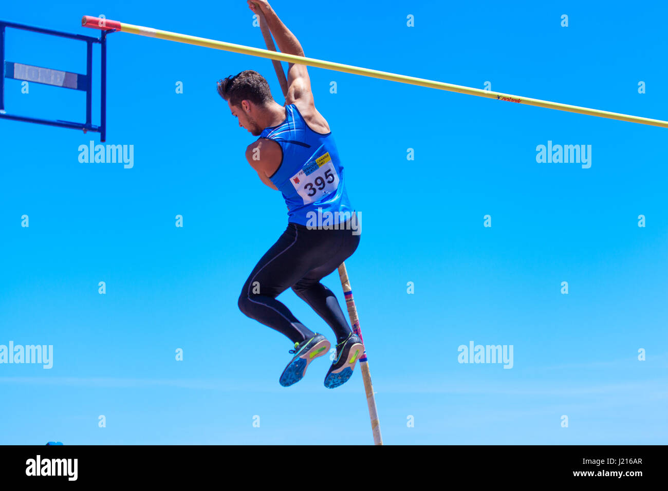 outdooor young adult male pole vaulting competition held 22nd april