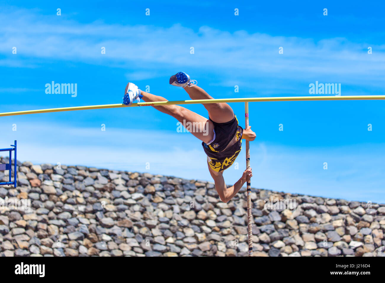 outdooor young adult male pole vaulting competition held 22nd april