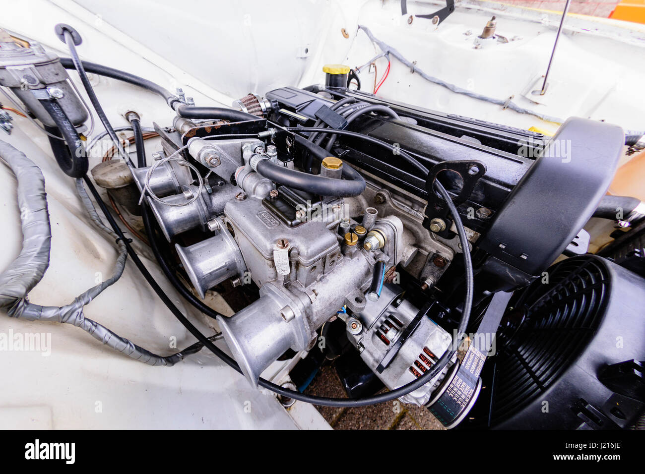 Performance quad carburettor on the engine of a Mark 1 Ford Escort. Stock Photo