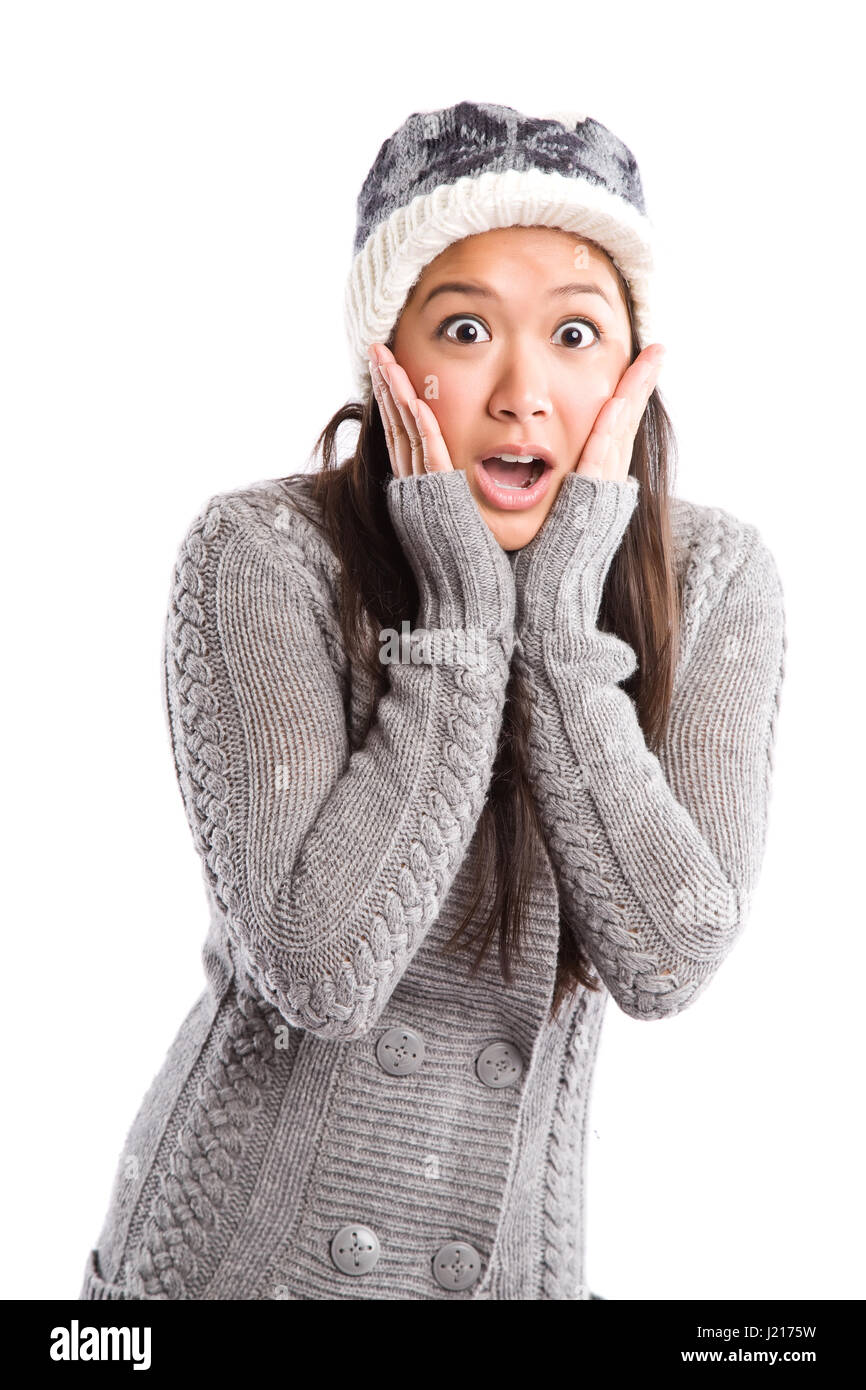 A shot of a surprised beautiful asian woman in winter outfit Stock Photo