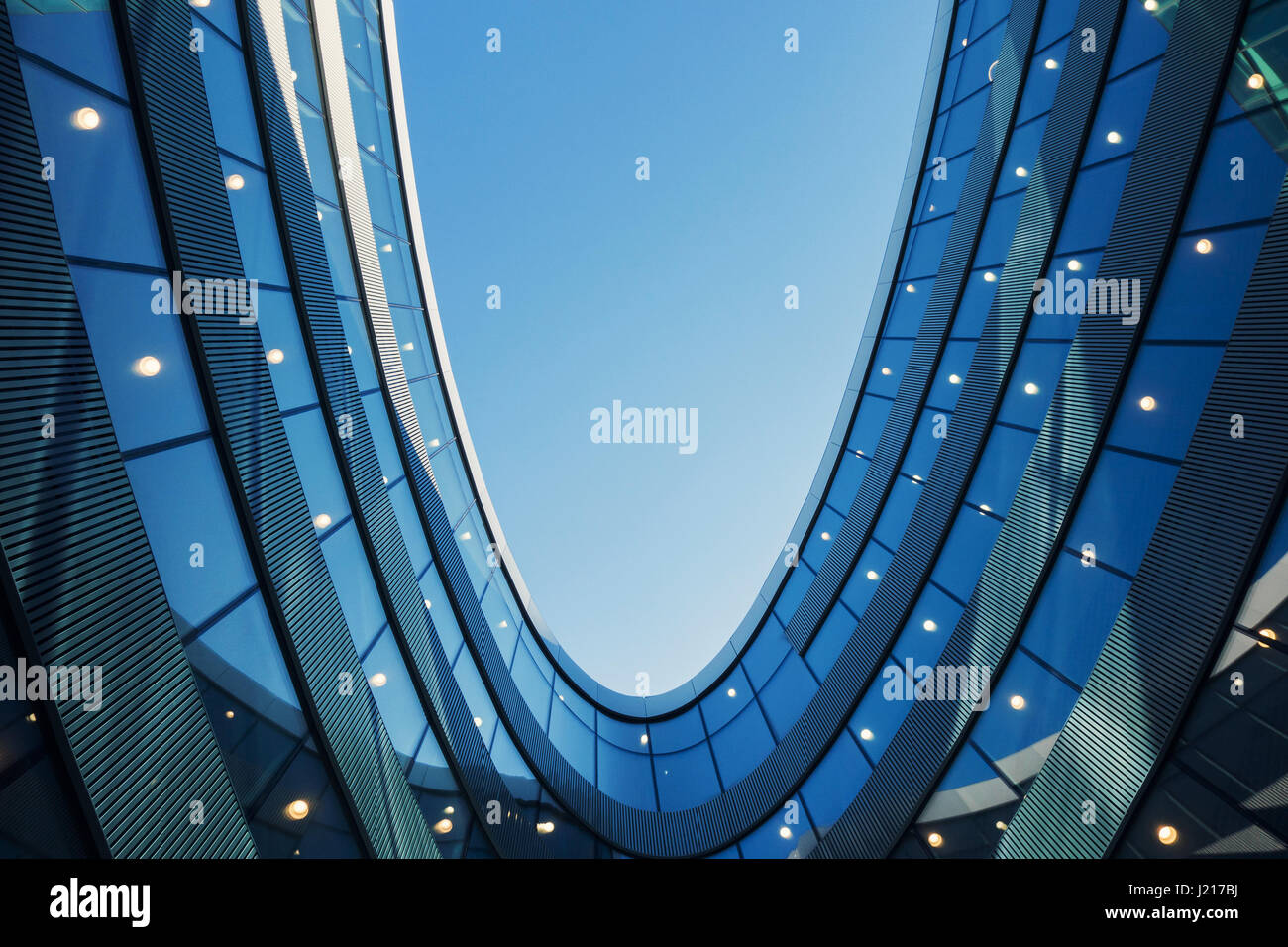 A part of modern business building against blue sky Stock Photo - Alamy