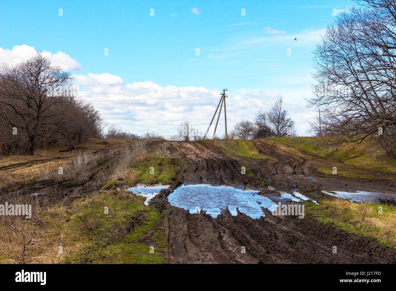 Dirty spring road Stock Photo - Alamy