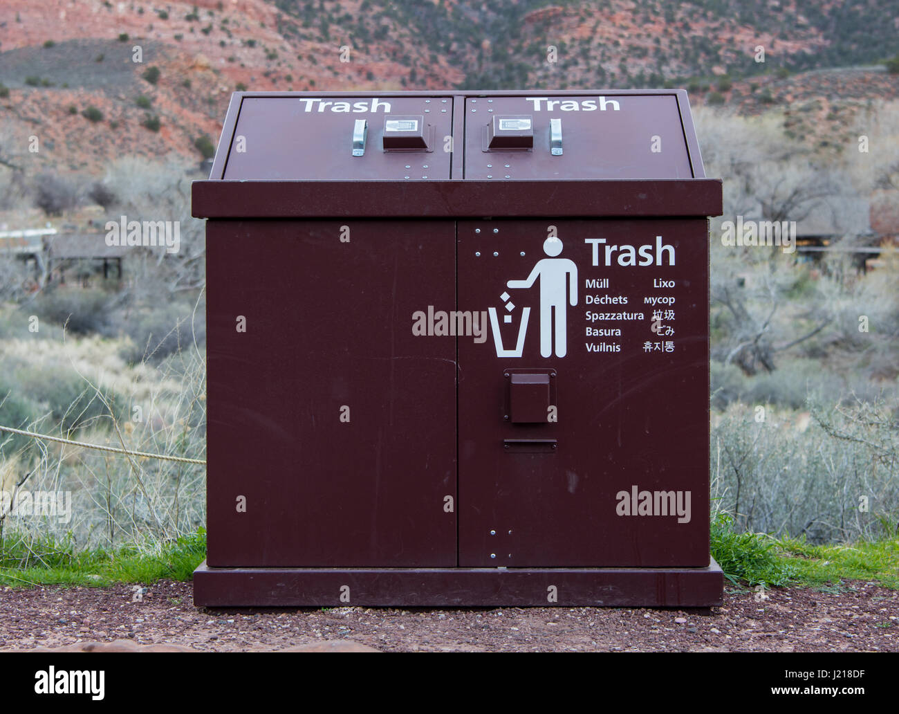 Trash Can in Many Languages in National Park Stock Photo Alamy