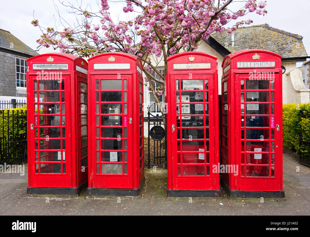 Four classic English Red Telephone Boxes Stock Photo