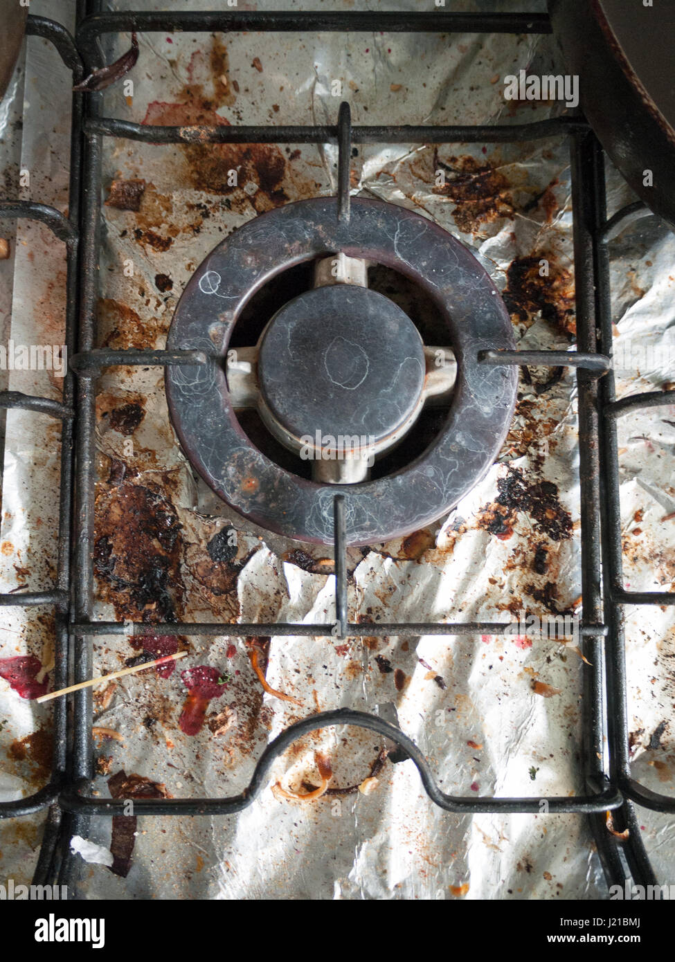 Rusty Rabge Cooker The Dirty and Grimy and Rusted Top of Gas Cooker Hob with Bits of Foil ...