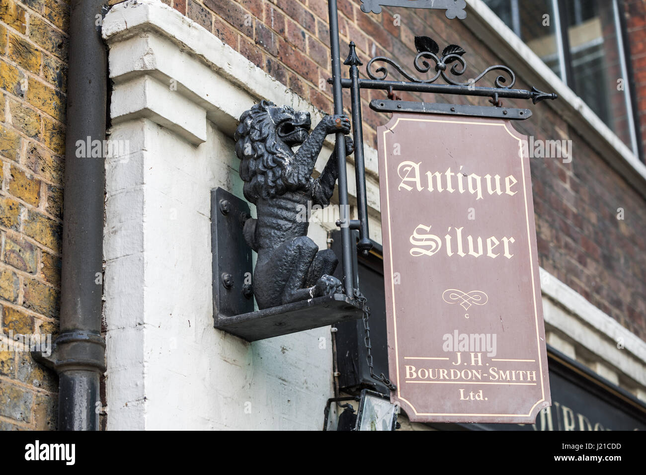 sign advertising a business that sells antique silver in London, England, UK Stock Photo