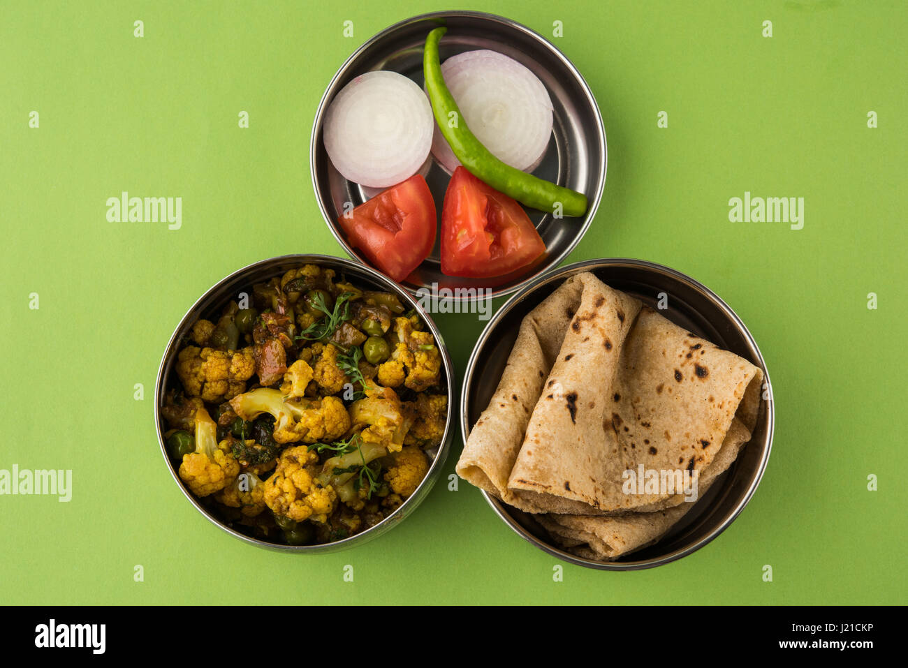 indian typical stainless steel lunch box or tiffin with north indian or