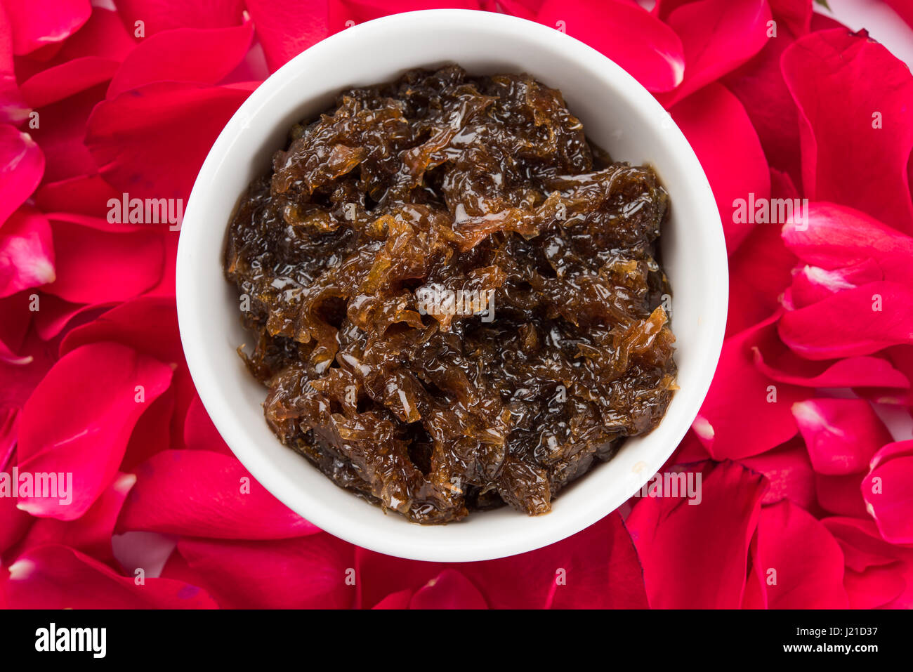 Gulkand, also known as Gulqand, is a sweet preserve of rose petals popular in India, usually used in chewing paan masala Stock Photo