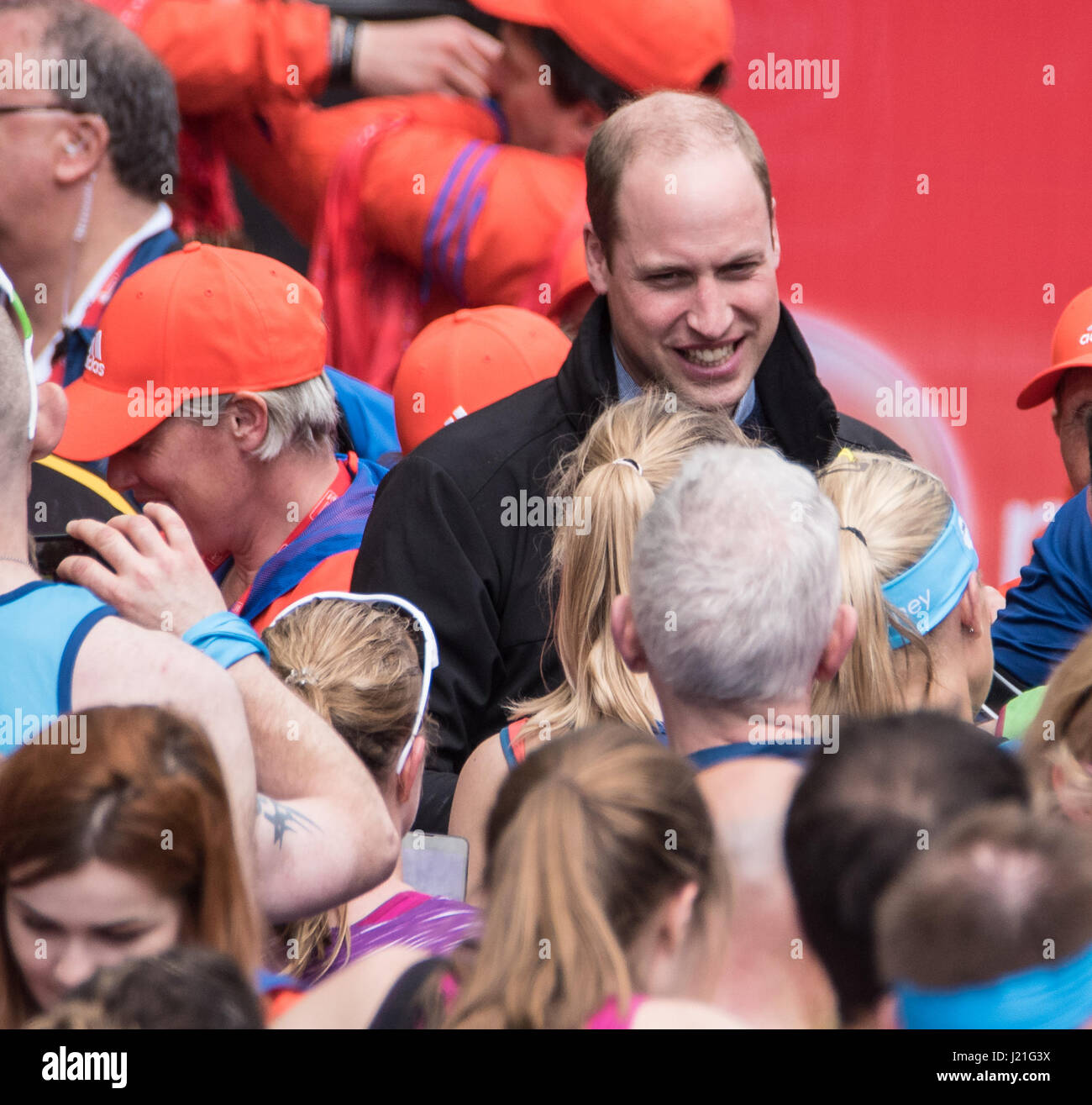 London, UK. 23rd April, 2017.HRH Prince William  Duke of Cambridge, hands out medals at the finish at the Virgin Money Marathon Credit: Ian Davidson/Alamy Live News Stock Photo