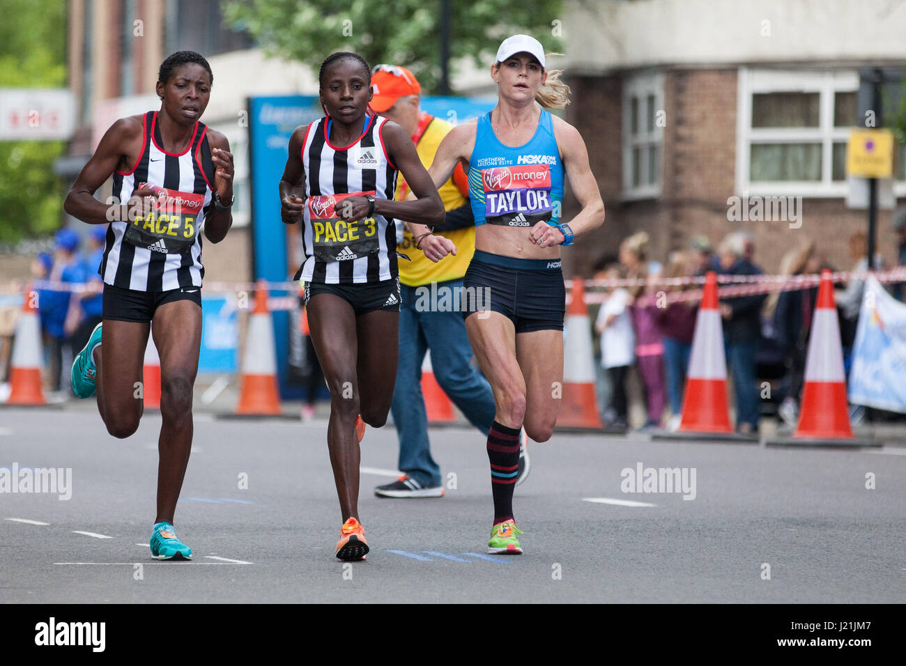 London, UK. 23rd April, 2017. Kellyn Taylor of the United States, who finished 13th in the women's event, runs through Shadwell close to the halfway point of the 2017 Virgin Money London Marathon. Credit: Mark Kerrison/Alamy Live News Stock Photo