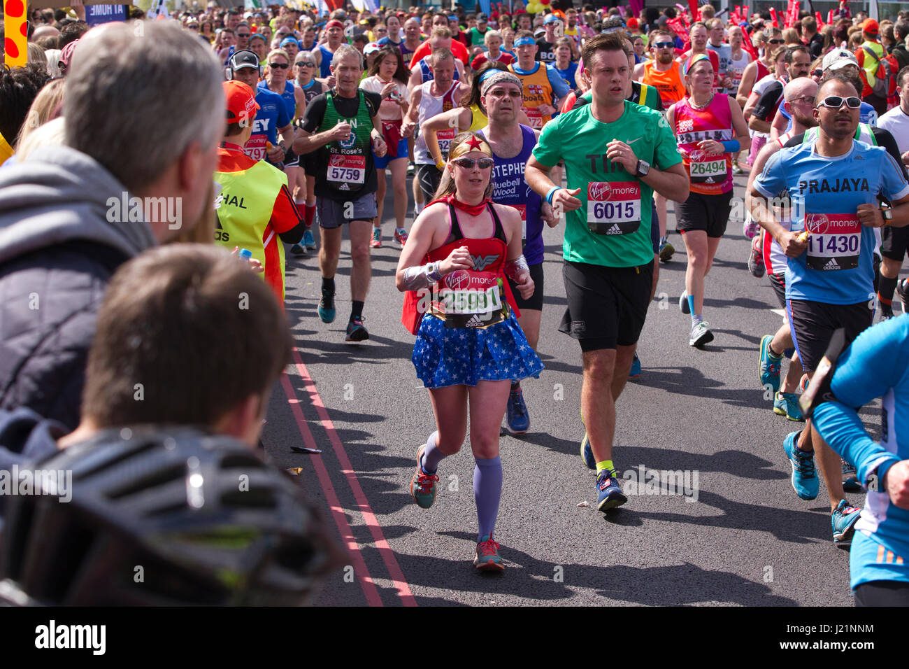 London, UK. 23rd April, 2017. LONDON MARATHON 2017. Today an estimated 50,000 runners took to the streets of the capital in to take part in the 37th London Marathon. The 26.2 mile race starts from Blackheath passing many of London's iconic landmarks including (pictured) the London Tower Bridge and finishing on the Mall. Stock Photo