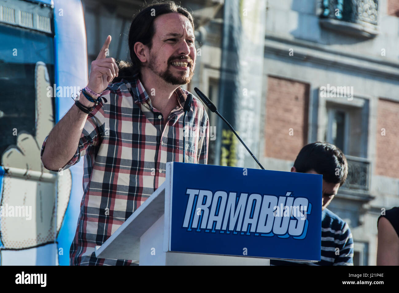Madrid, Spain. 23rd April, 2017. meeting of podemos with pablo iglesias with el tramabus a blue bus that circulate around madrid city and in the bus its draw a different politic characters with charges of corruption Credit: Alberto Sibaja Ramírez/Alamy Live News Stock Photo