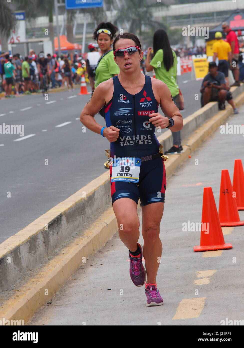 Pamela Tastets (Chile) running. Over 1653 athletes ran in the IRONMAN 70.3 Peru race at Agua Dulce beach in Chorrillos town, Lima. Stock Photo