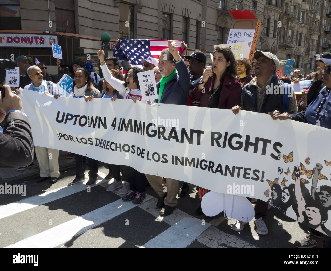 New York City NY, USA. 23rd Apr, 2017. Hundreds of protesters gathered in Harlem to rally and march from W.145th St. to Inwood in The Uptown March for Immigrants. Protesters demanded an end to detention and deportations, collaboration between ICE and local police, the separation of families, the Muslim ban, the wall, and the criminalization of immigrants. Credit: Ethel Wolvovitz/Alamy Live News Stock Photo