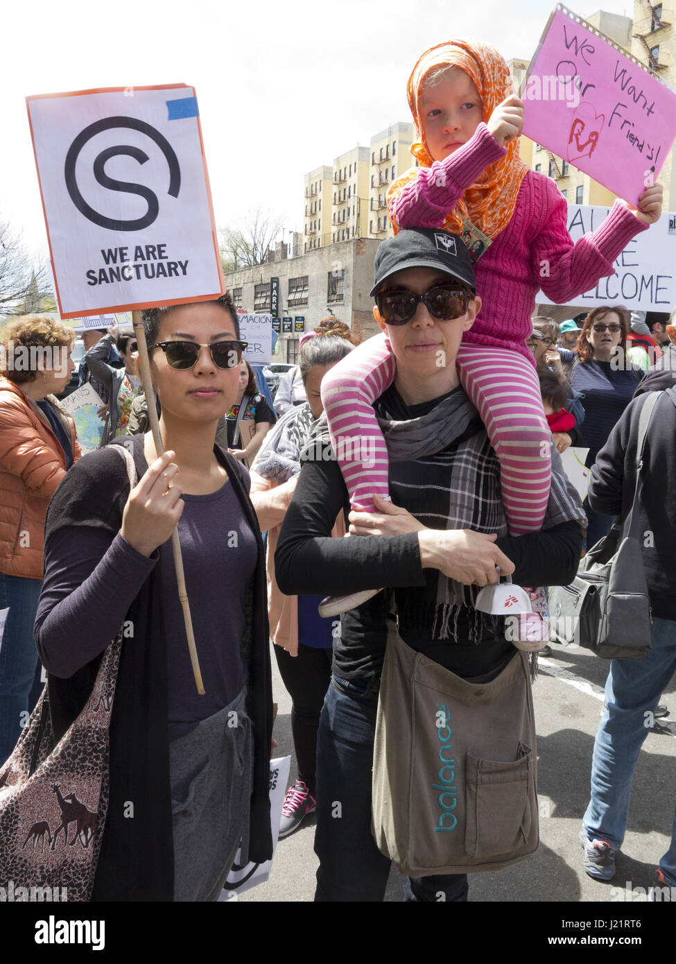 New York City NY, USA. 23rd Apr, 2017. Hundreds of protesters gathered in Harlem to rally and march from W.145th St. to Inwood in The Uptown March for Immigrants. Protesters demanded an end to detention and deportations, collaboration between ICE and local police, the separation of families, the Muslim ban, the wall, and the criminalization of immigrants. Credit: Ethel Wolvovitz/Alamy Live News Stock Photo