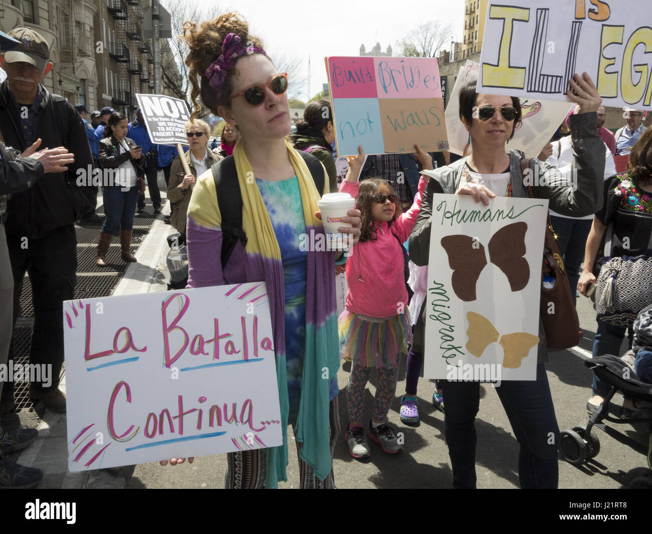 New York City NY, USA. 23rd Apr, 2017. Hundreds of protesters gathered in Harlem to rally and march from W.145th St. to Inwood in The Uptown March for Immigrants. Protesters demanded an end to detention and deportations, collaboration between ICE and local police, the separation of families, the Muslim ban, the wall, and the criminalization of immigrants. Credit: Ethel Wolvovitz/Alamy Live News Stock Photo