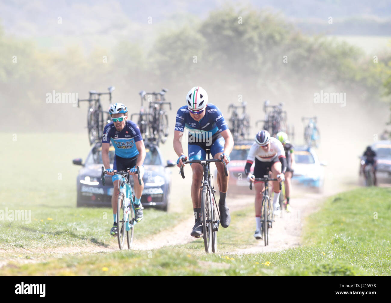 Rutland, UK. 23rd April, 2017. Rutland - Melton CiCLE Classic 2017. In photo: A Bike Channel-Canyon rider, rides up 'Somerberg' followed by the team vehichles. Photo by Dan Matthams Photography. Credit: Daniel Matthams/Alamy Live News Stock Photo