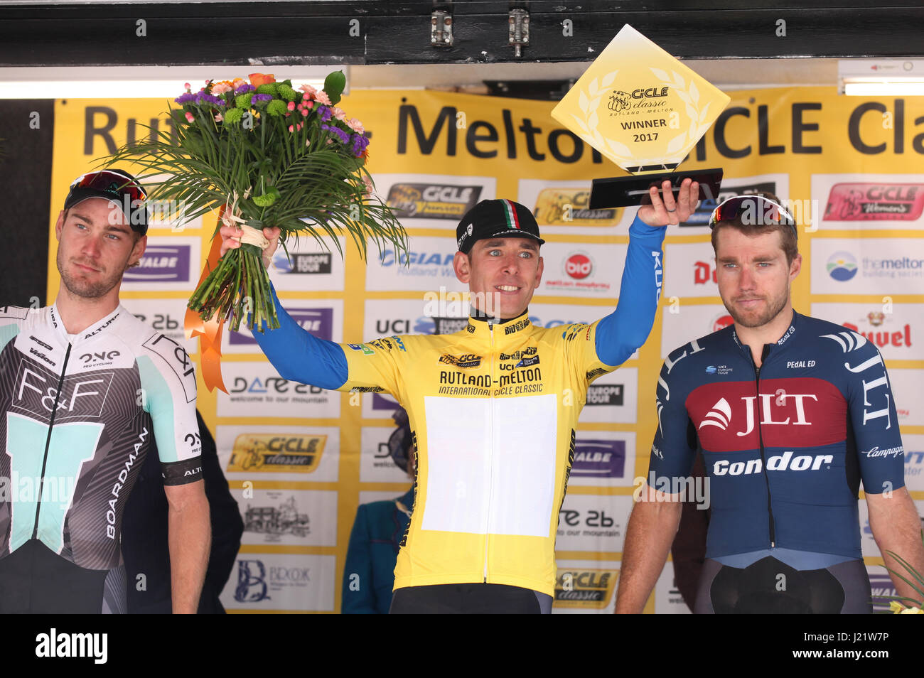 Rutland, UK. 23rd April, 2017. Rutland - Melton CiCLE Classic 2017. In photo: Metaltek-Kuota's Dan Fleeman (centre) lifts the winner's trophy flanked by runner up ONE Pro Cycling's Hayden McCormick, left, and JLT Condor's Brenton Jones, right. Photo by Dan Matthams Photography. Credit: Daniel Matthams/Alamy Live News Stock Photo