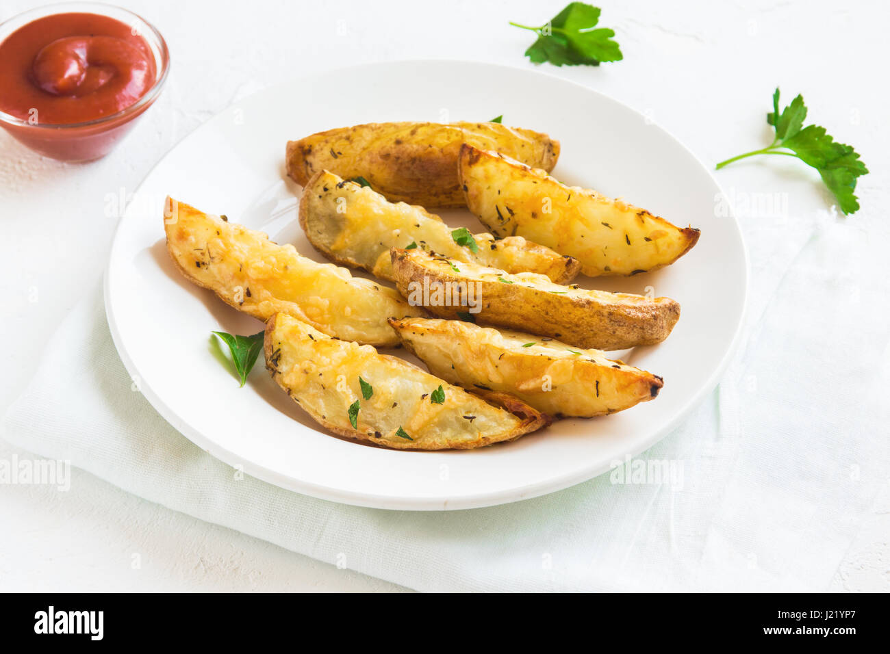 Baked Potato Wedges With Cheese And Herbs And Tomato Sauce On White Plate Homemade Organic Vegetable Vegan Vegetarian Potato Wedges Snack Food Meal Stock Photo Alamy