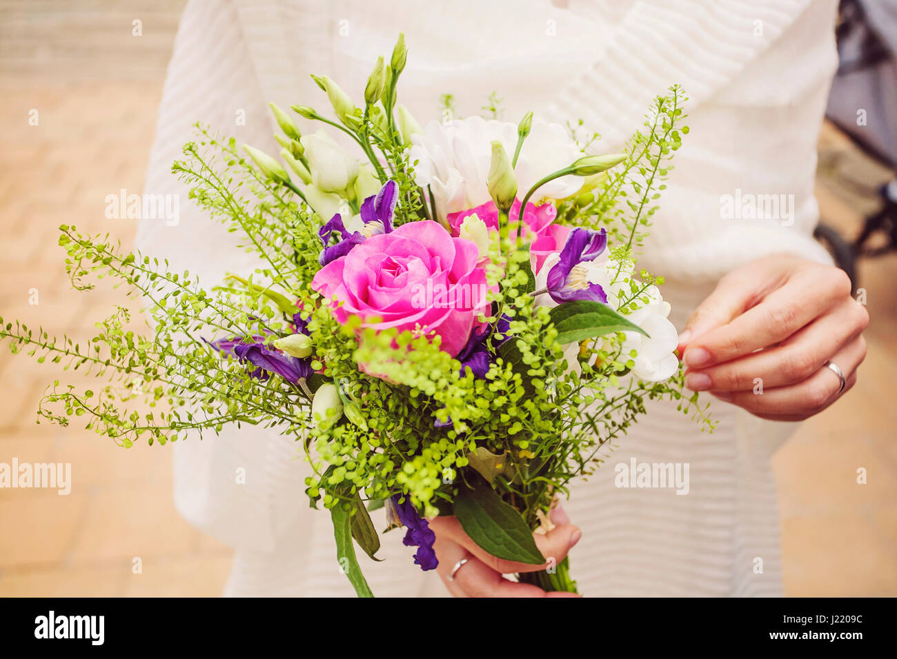 Wedding bouquet in bride hands Stock Photo