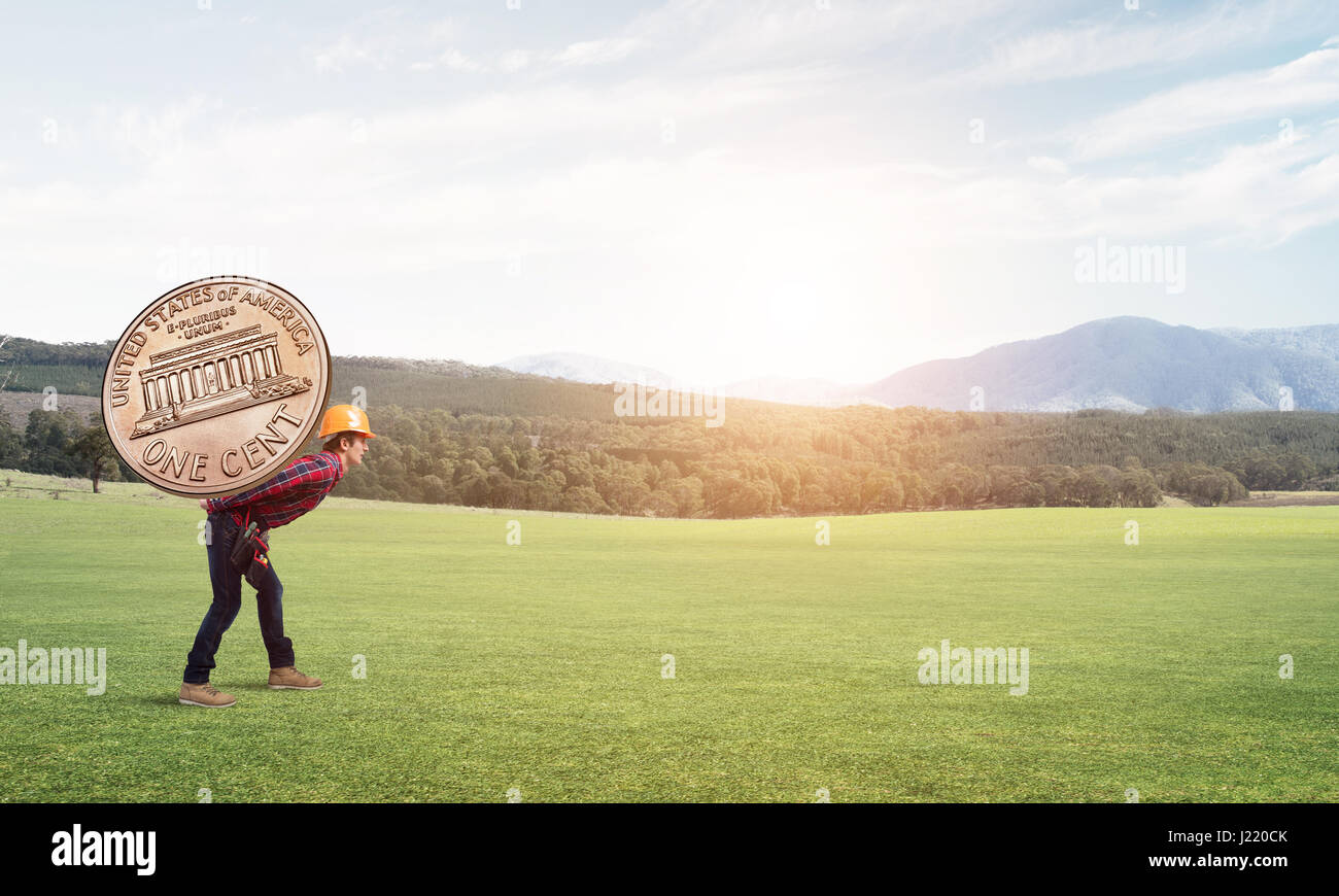 Builder man carry coin Stock Photo Alamy