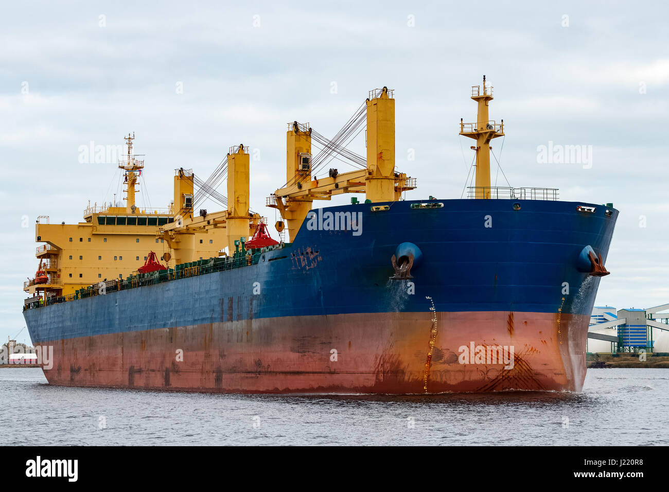Blue cargo ship entering the port of Riga, Europe Stock Photo - Alamy