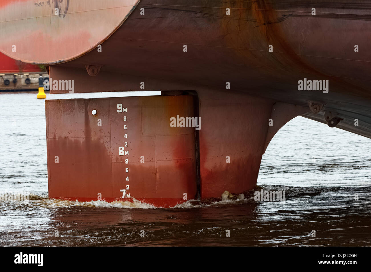 Big red cargo ships stern close up Stock Photo - Alamy