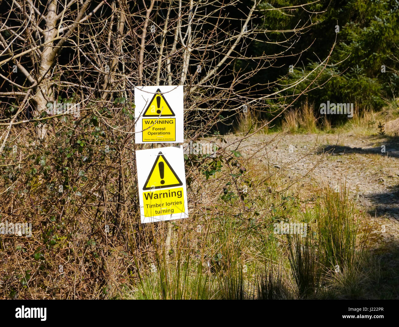 Signs warning walkers of logging activity on the route up to the summit