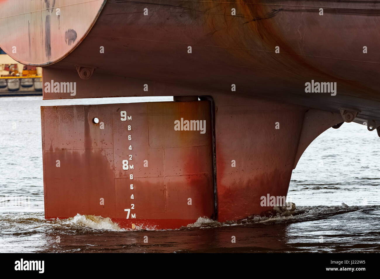 Big red cargo ships stern close up Stock Photo - Alamy