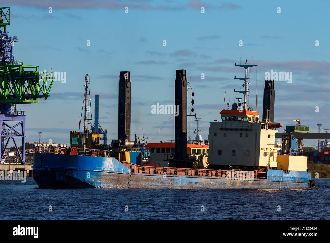 Blue cargo ship in the port of Riga, Europe Stock Photo - Alamy