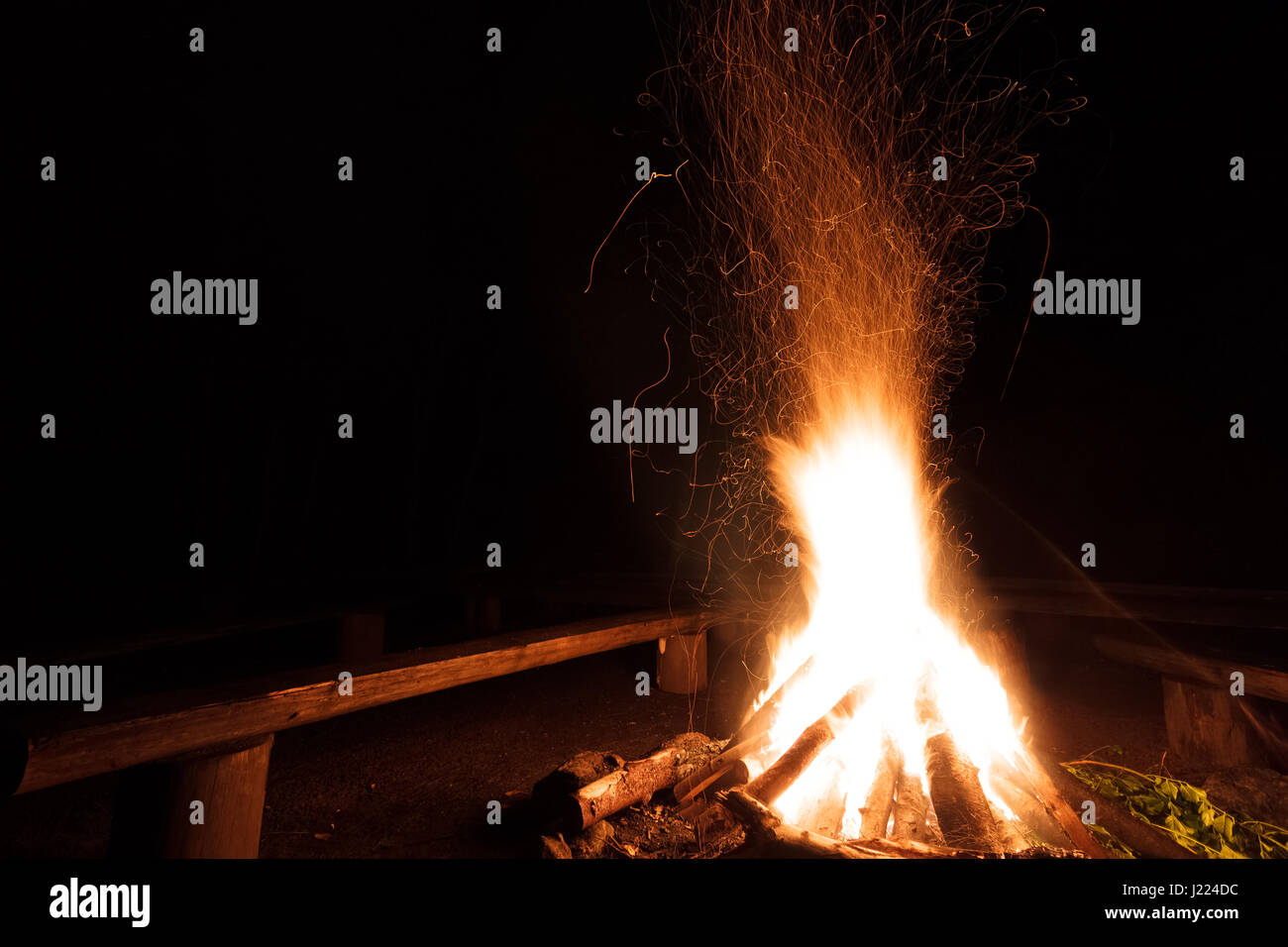 Campfire with flying sparks in the night Stock Photo - Alamy