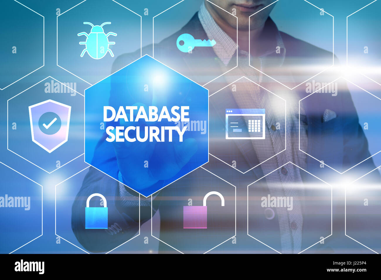 Business, technology, internet and networking concept. Businessman presses a button on the virtual screen: Database security Stock Photo
