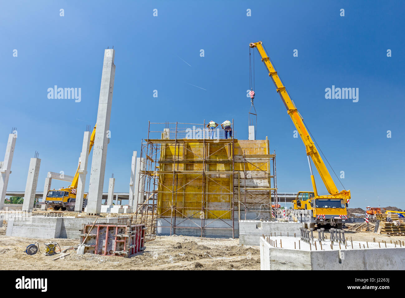 Preparation is in progress to assembly wooden mold for concrete pouring, teamwork. Stock Photo