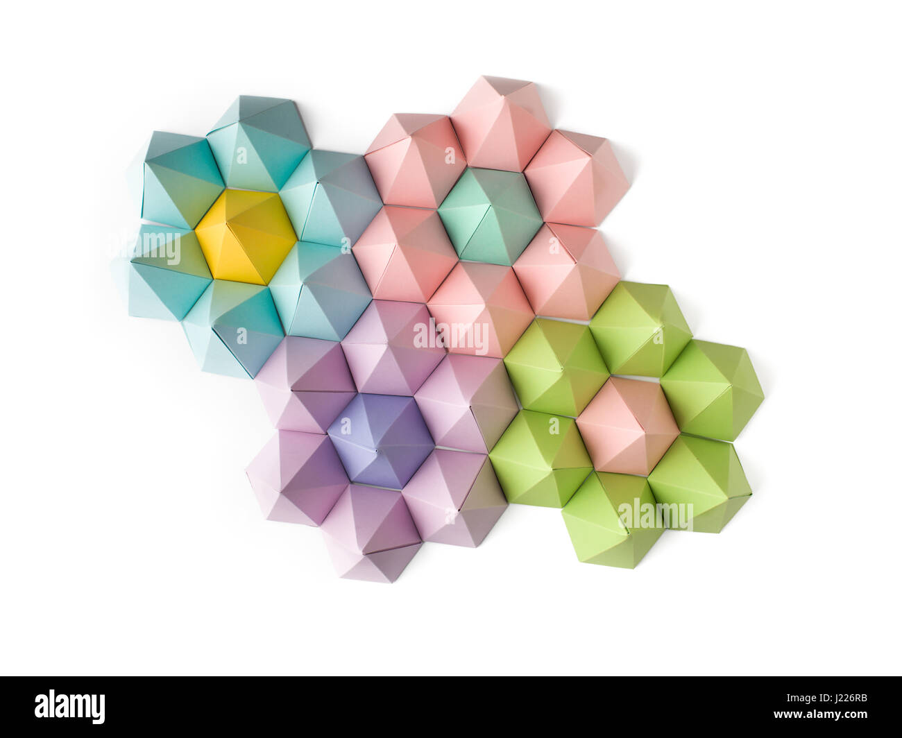 Abstract origami flowers made of hexagonal paper pyramids Stock Photo