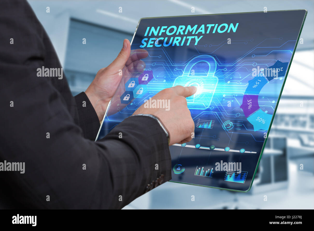 Business, Technology, Internet and network concept. Business man working on the tablet of the future, select on the virtual display: Information secur Stock Photo