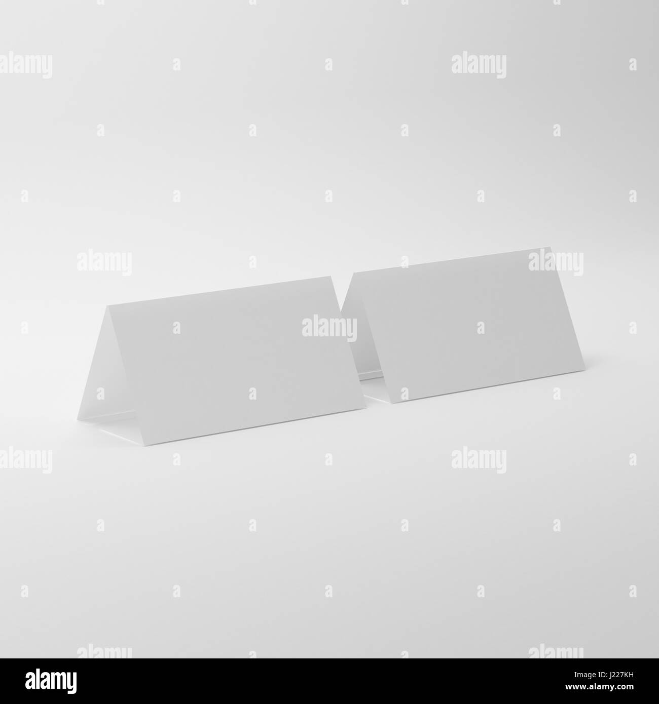 White Blank Table Tent Mock-Ups On Isolated White Background, Table Tent For Your Design Presentation Stock Photo