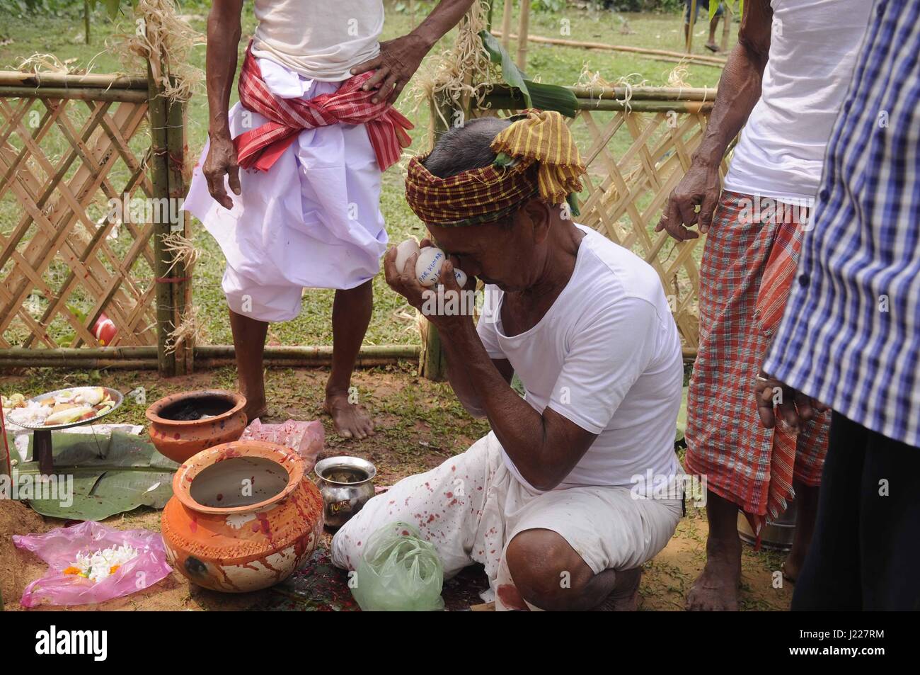 Festival to honour the deity Garia -  21/04/2017  -  India / Tripura / Agartala  -  INDIA, TRIPURA-APRIL 21:Priest offering puja in front -God Garia-, one of the biggest annual religious festivals mainly of the tribals in Tripura on April 21st 2017.               A three-day festival to honour the deity Garia is held annually on the first day of the Hindu calendar month of 'Vaisakh' (mid-April).   -  Abhisek Saha / Le Pictorium Stock Photo