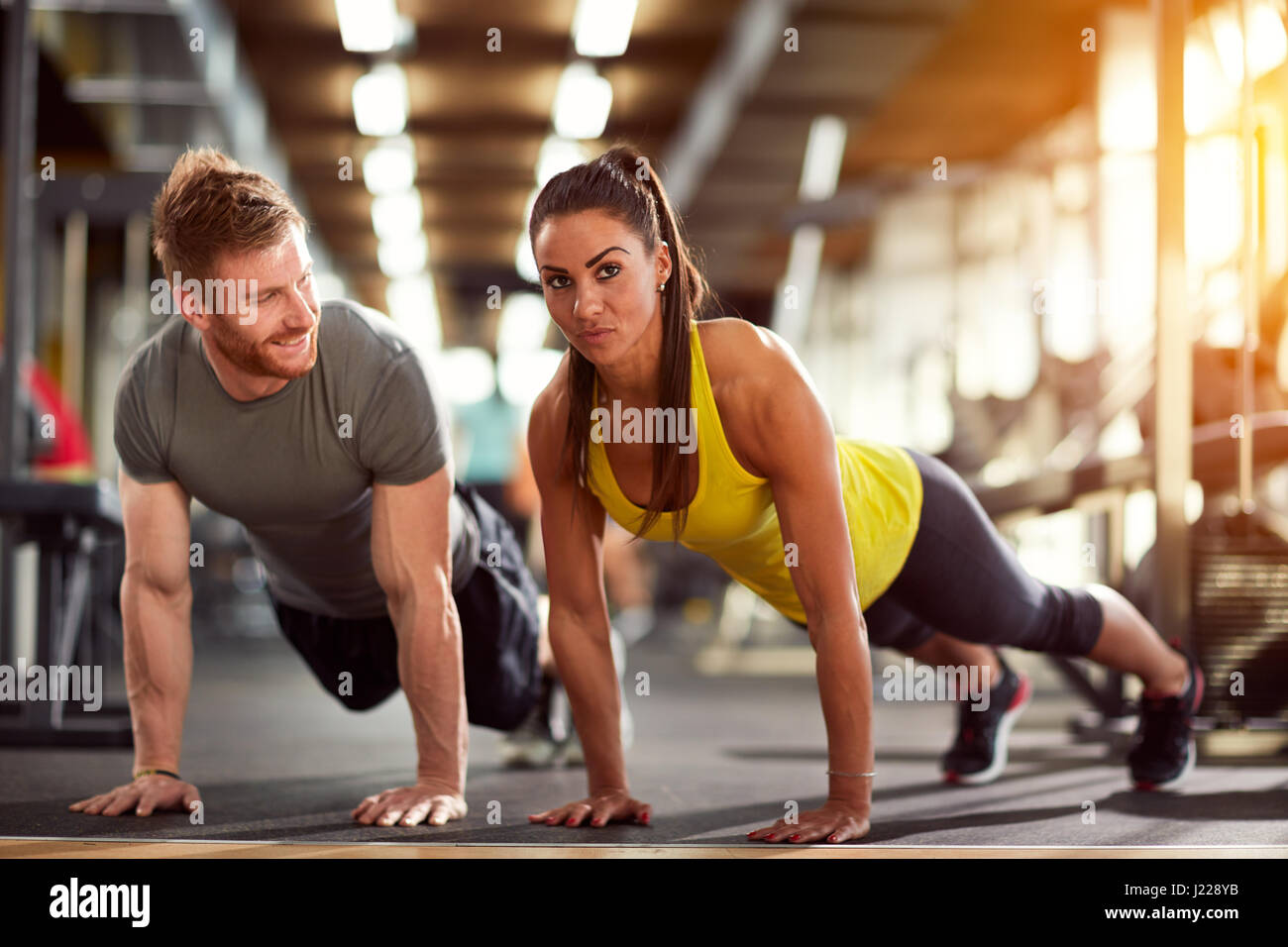 Couple on exhausting fitness training together Stock Photo