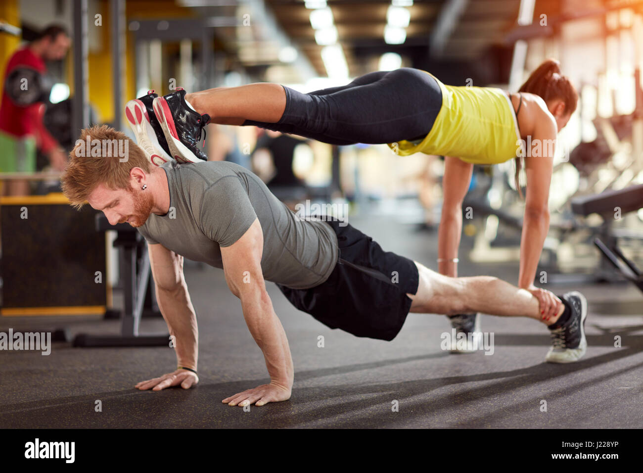 Sports couple trains together in fitness club Stock Photo