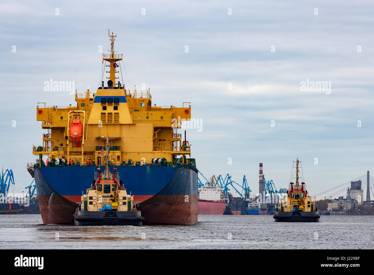 Blue cargo ship entering the port of Riga, Europe Stock Photo - Alamy