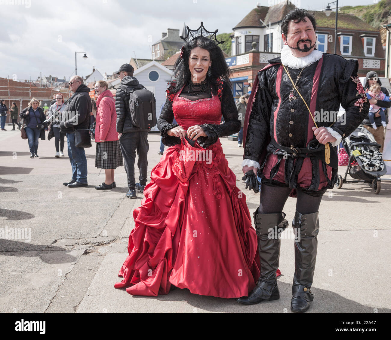 A man and woman pose for photos at the Whitby Goth celebrations in North Yorkshire,England,UK Stock Photo