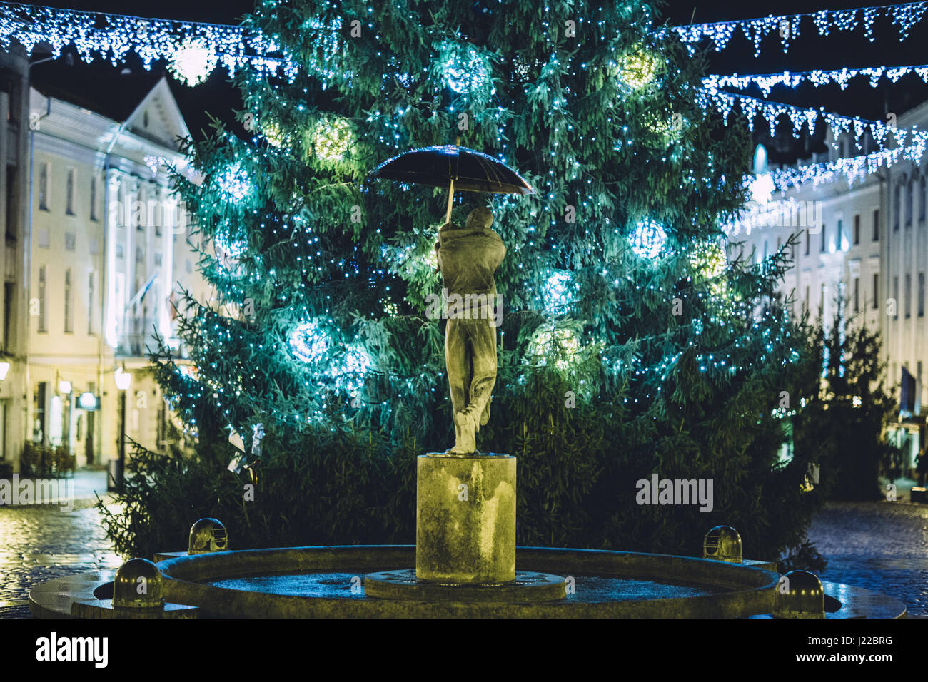 The ,,kissing students'' fountain and christmas tree in tartu town hall Stock Photo