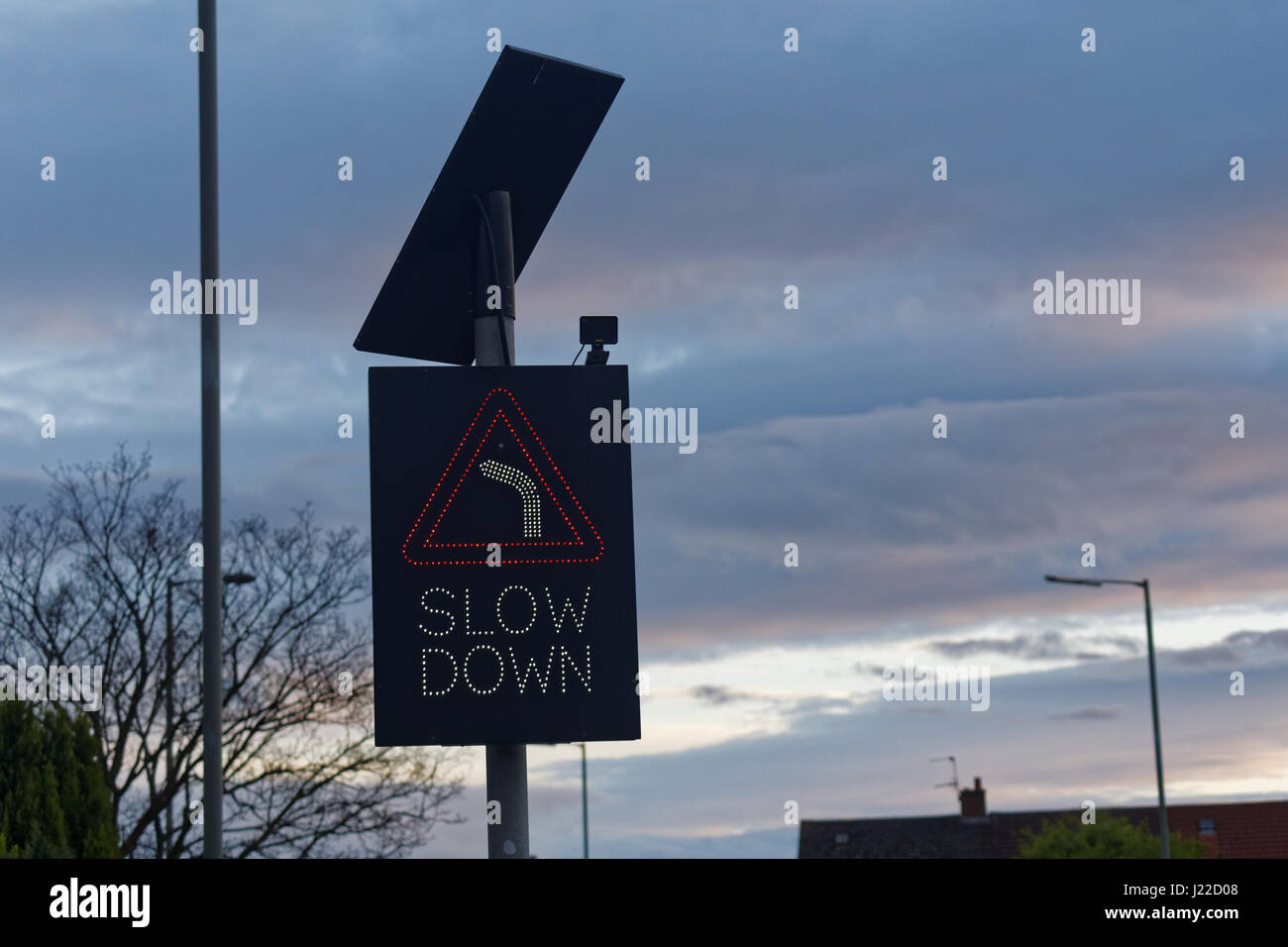 slow down sign traffic Stock Photo