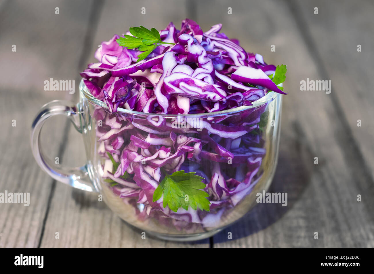 Salad of red cabbage. Wooden background, selective focus Stock Photo
