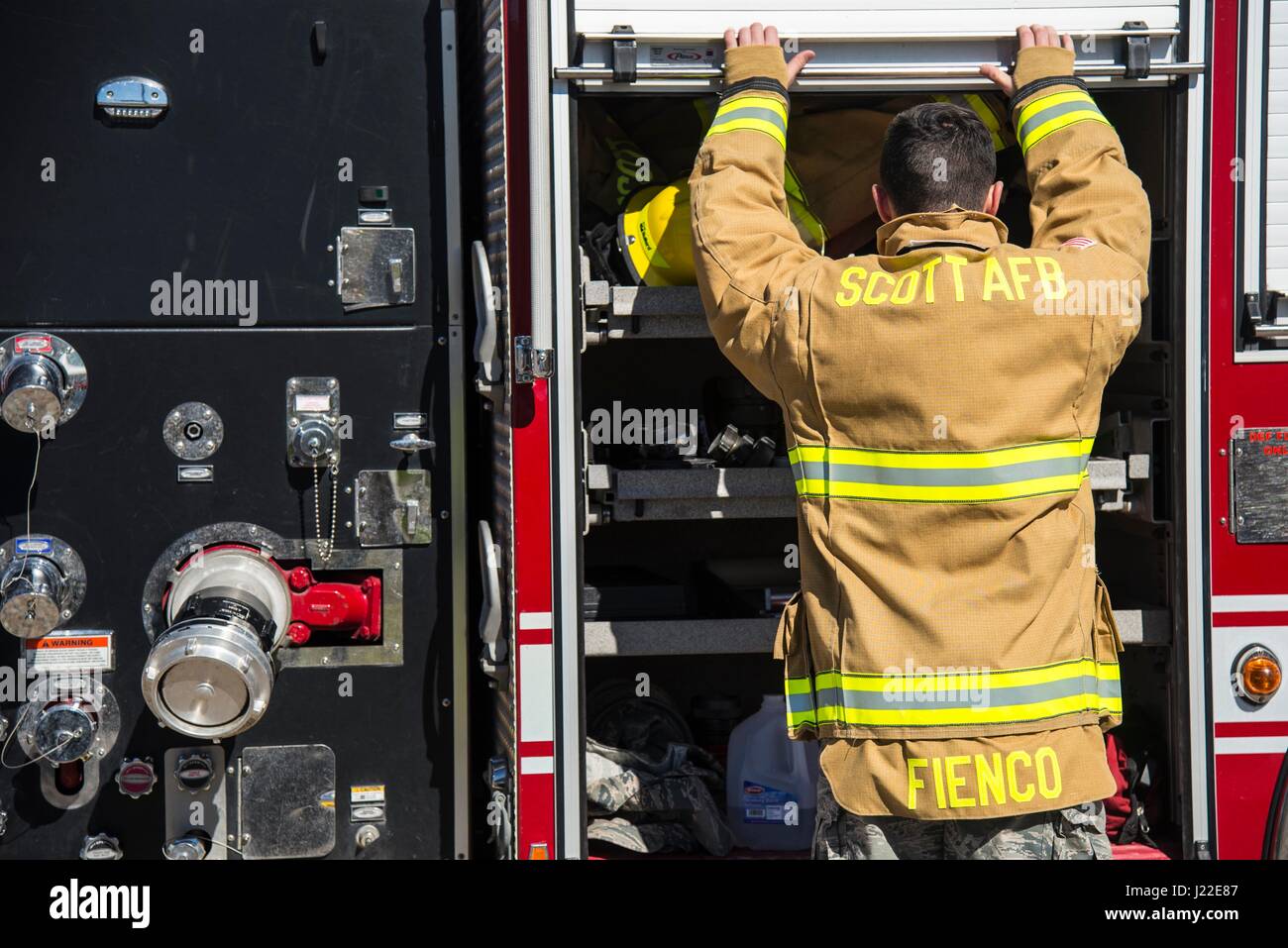 Firefighters with the 375th Civil Engineer Squadron perform drills in
