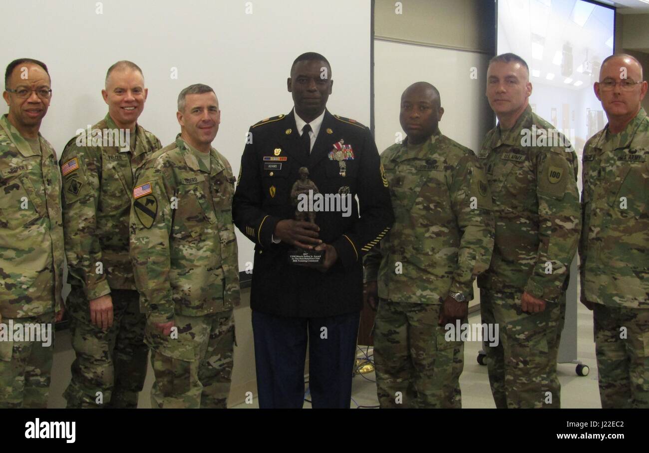 (Left to right) Maj. Gen. A.C. Roper, Brig. Gen. Aaron Walter, Col. Raymond Elderd, III, Sgt. Maj. Cornell Adams, Command Sgt. Maj. Sherman Fox, Command Sgt. Maj. Andrew Lombardo, and Command Sgt. Maj. Jeffrey Darlington pose for photos at the 80th Training Command's Command Sgt. Maj. Morris Salley, Jr. Award ceremony.  Adams received the annual award at the 80th's commanders conference at Fort Snelling, Minnesota, April 8, 2017, for his outstanding leadership and community service. (Photo by Master Sgt. Stacey Everett, 80th Training Command Headquarters and Headquarters Company) Stock Photo