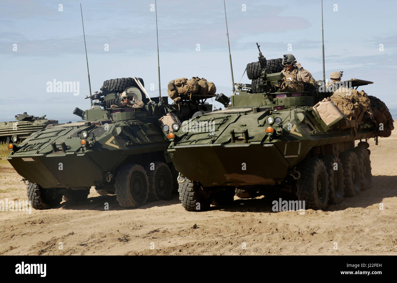 The 15th MEU practices amphibious assault exercises on Red Beach at Camp Pendleton April 13, 2017. After offloading from the L-CAC, the squad of each LAV straps their main pack to outside of their LAV in order to have more room to maneuver inside the Light Armored Vehicle. (U.S. Marine Corps photo by Lance Cpl. Dylan Overbay) Stock Photo