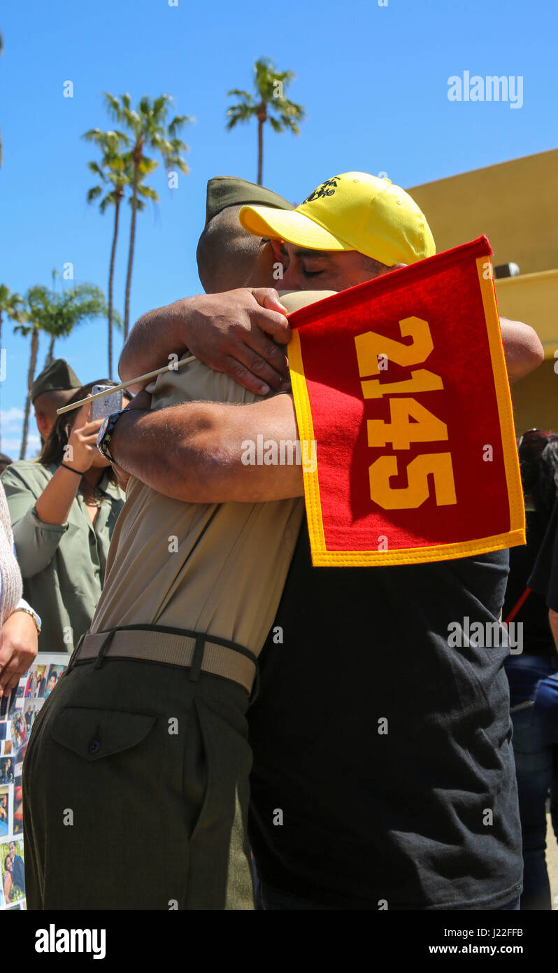 The new Marines of Golf Company, 2nd Recruit Training Battalion, embrace their loved ones during liberty call at Marine Corps Recruit Depot San Diego, today.  After nearly thirteen weeks of training, the Marines of Golf Company will officially graduate from recruit training tomorrow. Stock Photo